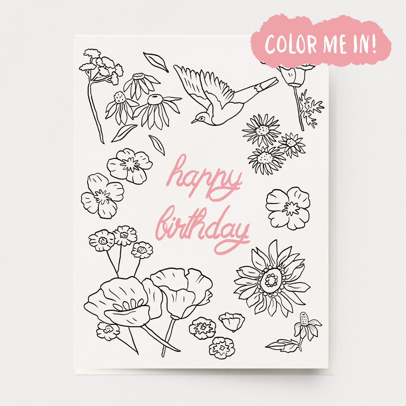 A coloring birthday card of flowers and a bird, with the text "happy birthday" in the center in pink. Hand illustrated by artist Katherine Lewis. Made by Ingrid Press card and gift company, ethically printed in the USA.