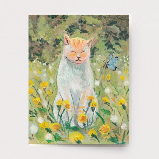 A pained greeting card of a happy cat sitting in a summer field of dandelions with a butterfly, Ingrid Press made in the USA