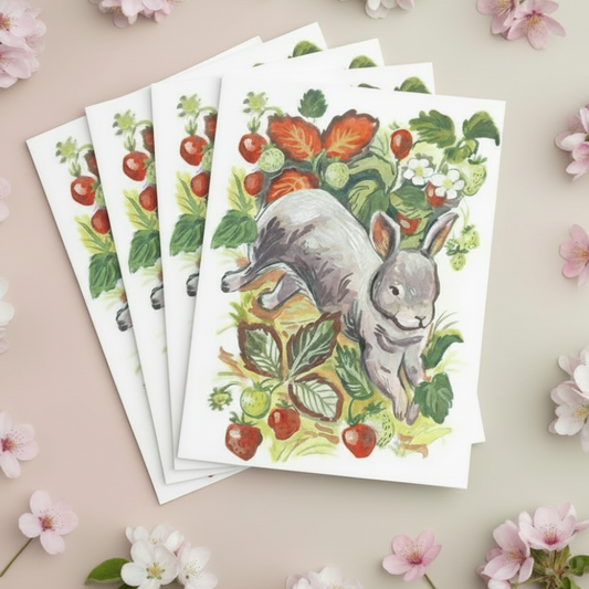 Set of greeting cards with a rabbit illustration surrounded by flowers on a beige background