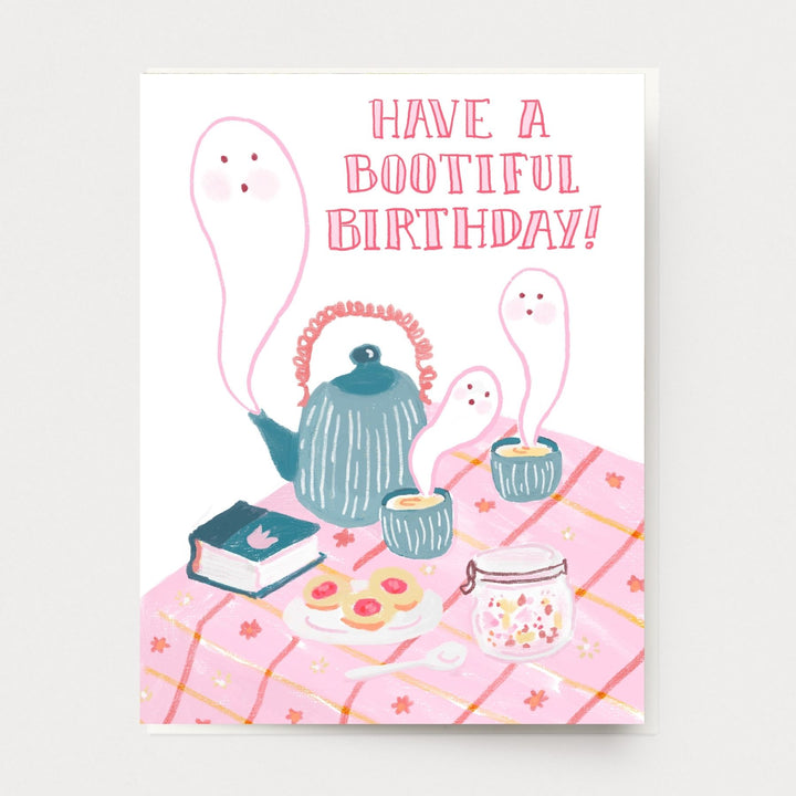 A cute and spooky birthday card with a pink tea party and ghosts