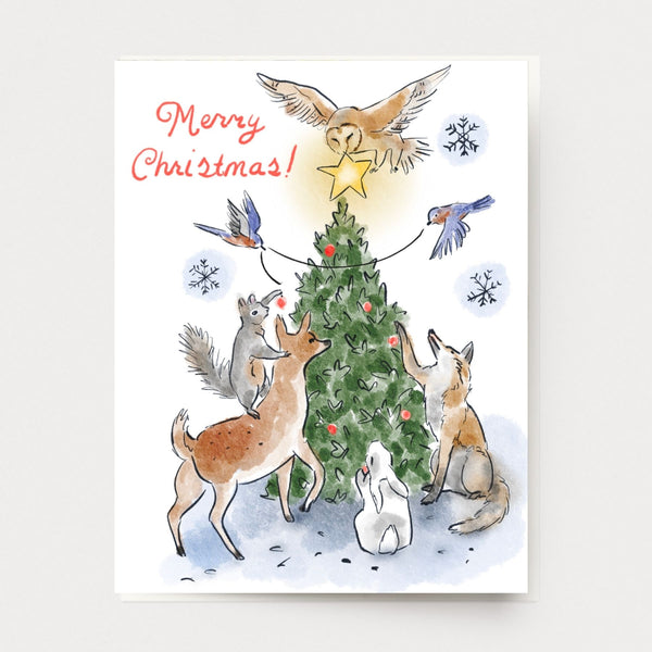 Watercolor Christmas card with animals decorating a tree together: Birds, deer, fox, rabbit squirrel and owl, hand illustrated and made in the usa