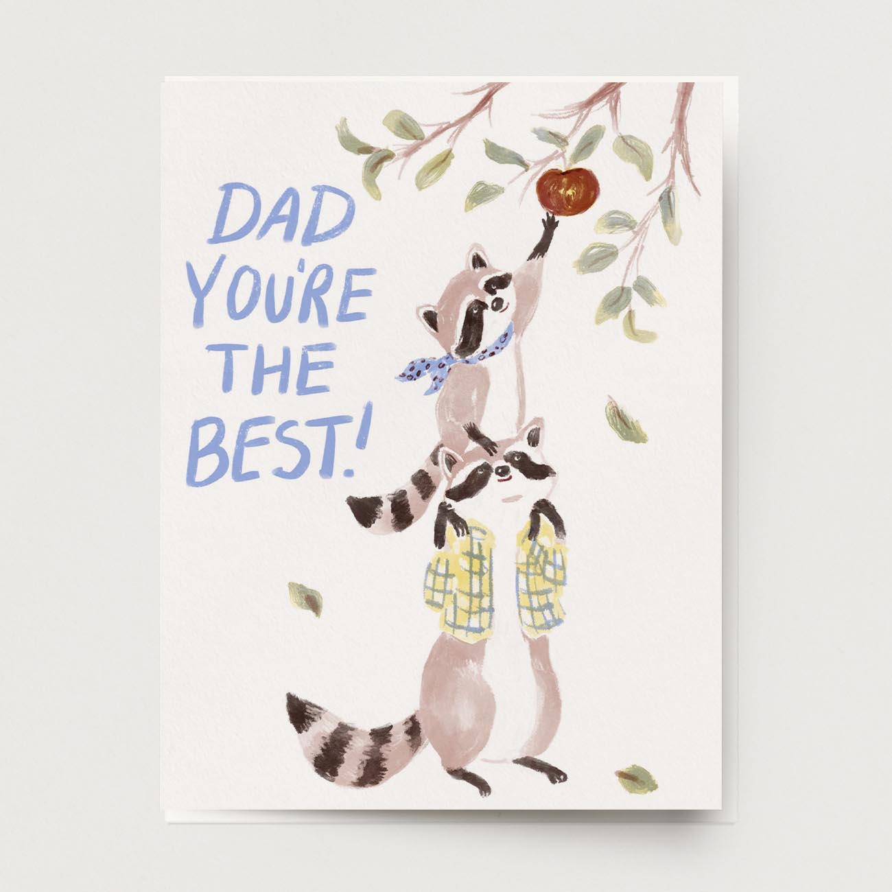 A greeting card with an illustration of a raccoon and a bird. The raccoon is reaching up to offer an apple to the bird, with the text 'DAD YOU'RE THE BEST!' written at the top.