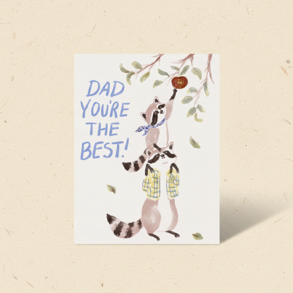 Greeting card with raccoons and text 'Dad you're the best!' on a beige background
