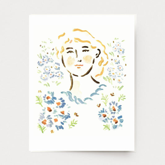 Greeting card with llustration of a woman's face surrounded by floral elements on a white background