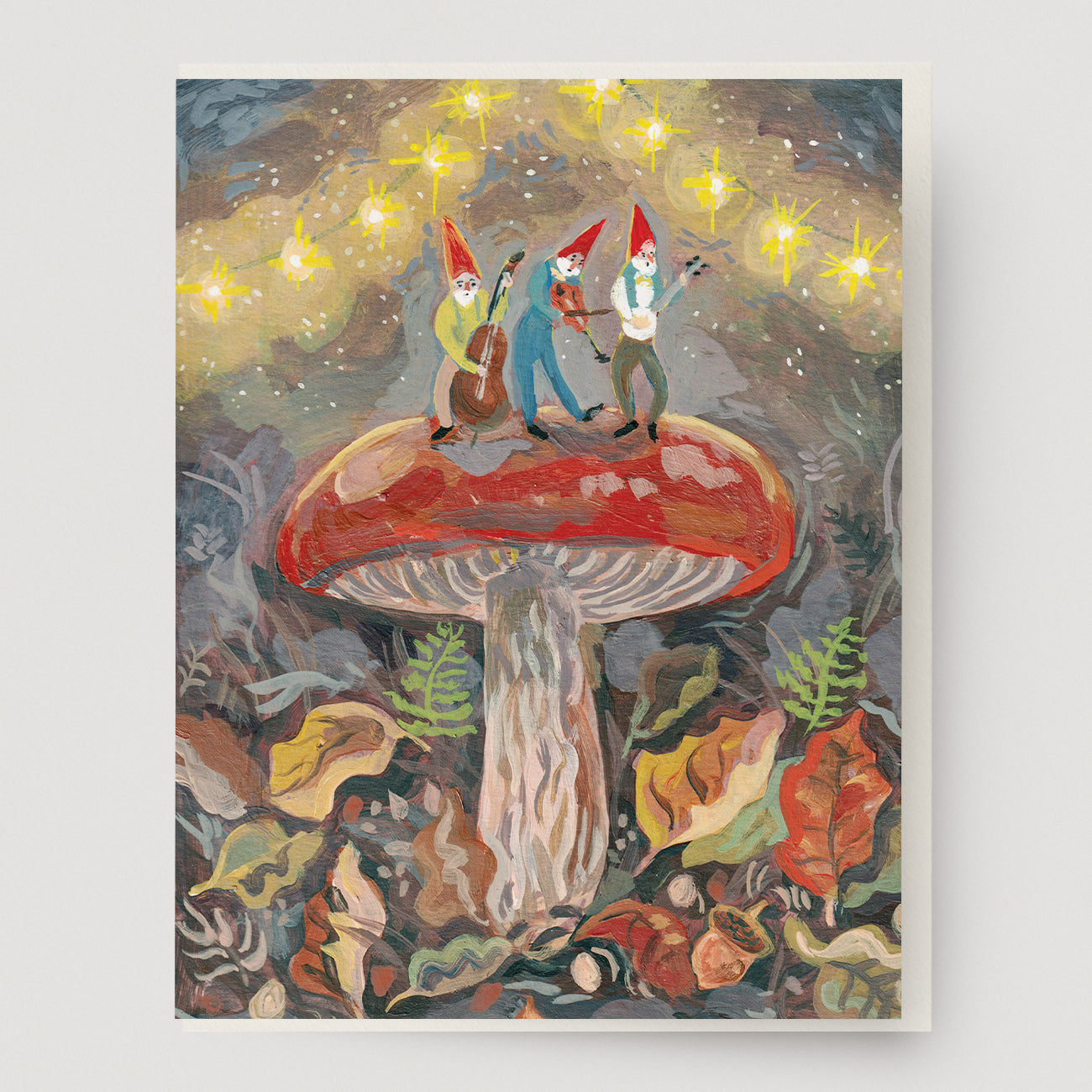 Artistic greeting card of three gnomes on a large mushroom with a starry night sky background.
