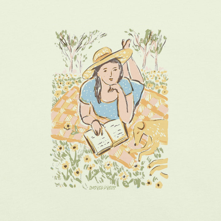 Green T-shirt print with a young woman, reading a book in a park with flowers, with her dog in Paris