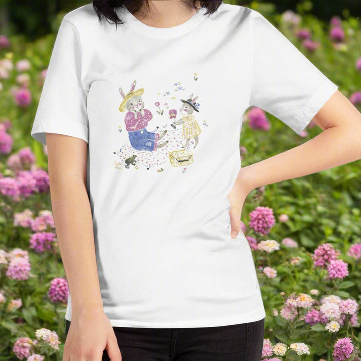 T-shirt with rabbits having a picnic with flowers a frog, done in a japanese art style