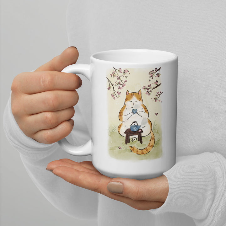 Japanese art style mug with cat drinking matcha tea and cherry blossoms