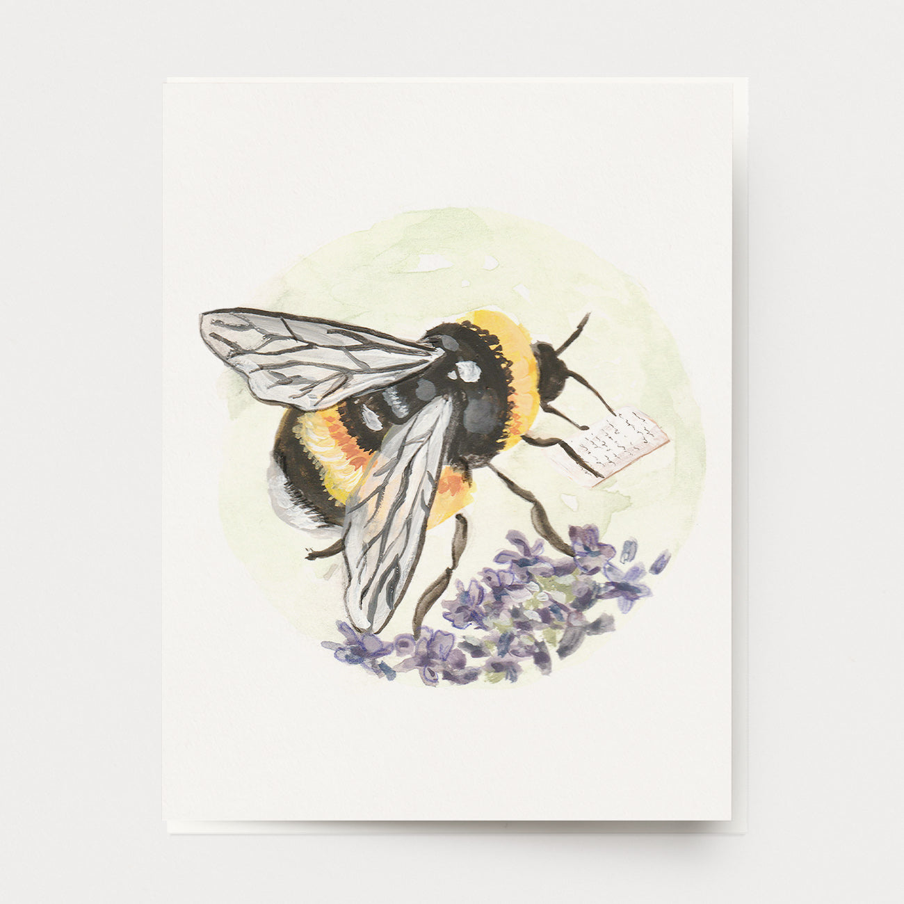 A penpal greeting card of a honey bee on lavender flowers, reading a letter from a friend. Painted in colorful watercolor paint, in the style of Beatrix Potter, by Mendocino Coast artist Katherine Lewis. Made by Ingrid Press card and gift company, ethically printed in the USA.