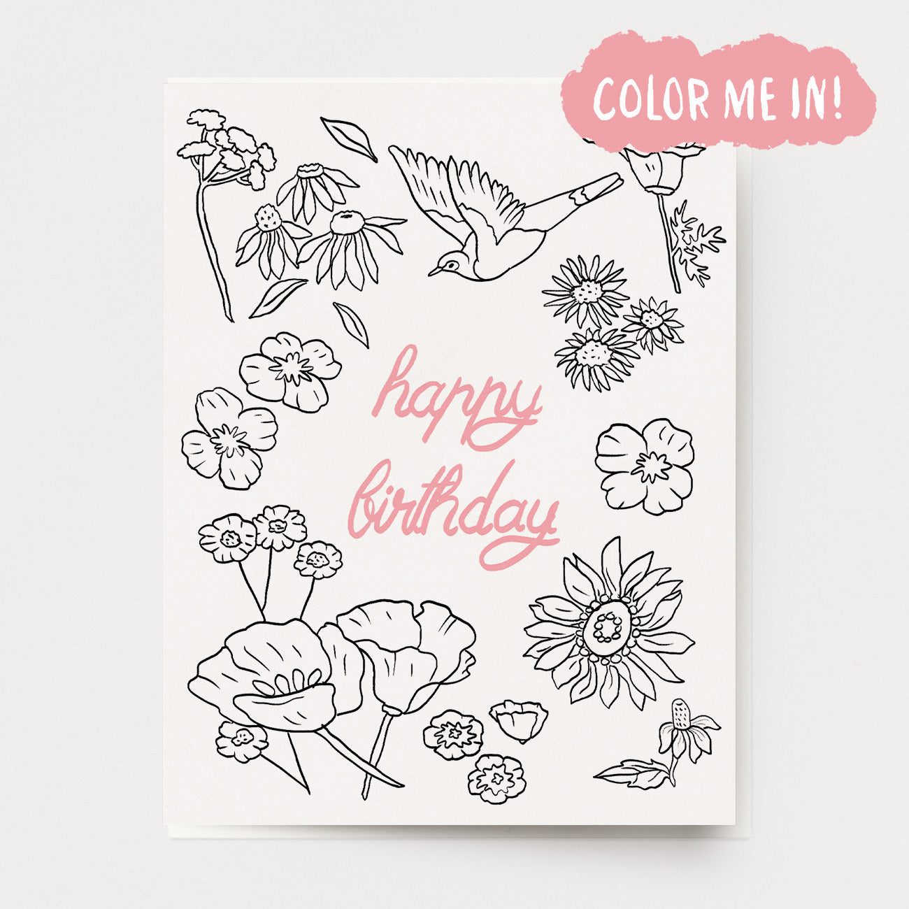 A coloring birthday card of flowers and a bird, with the text "happy birthday" in the center in pink.  Hand illustrated by artist Katherine Lewis. Made by Ingrid Press card and gift company, ethically printed in the USA.