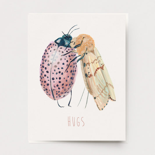 An encouragement greeting card of bugs, a beetle and a moth hugging, Ingrid Press, made in the USA
