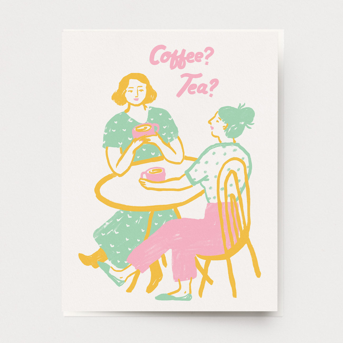 A greeting card of two friends meeting at a cafe with the words, Coffee? Tea? Ingrid Press, made in the USA.